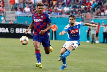 Napoli's Dries Mertens (R) battles for the ball with Barcelona's Jean-Clair Todibo during the International Champions Cup football match between FC Barcelona and SSC Napoli at Hard Rock Stadium in Miami, Florida, on August 7, 2019