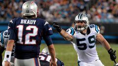Carolina Panthers linebacker Luke Kuechly, right, points and yells out instructions to the defensive line as New England Patriots quarterback Tom Brady prepares to call a play during second quarter action at Bank of America Stadium in Charlotte, NC on Friday, August 28, 2015. 