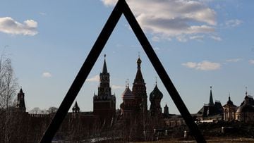 The Kremlin&#039;s Spasskaya Tower and St. Basil&#039;s Cathedral are seen through the art object in Zaryadye park in Moscow, Russia March 15, 2022.