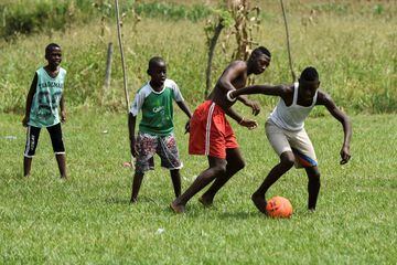 Young boys play football in Yerry Mina's hometown Guachené.