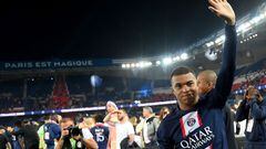 Paris Saint-Germain's French forward Kylian Mbappe waves during the 2022-2023 Ligue 1 championship trophy ceremony following the L1 football match between Paris Saint-Germain (PSG) and Clermont Foot 63 at the Parc des Princes Stadium in Paris on June 3, 2023. (Photo by FRANCK FIFE / POOL / AFP)
