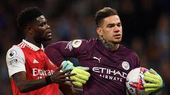 Manchester City's Brazilian goalkeeper Ederson (R) refuses to return the ball to Arsenal's Ghanaian midfielder Thomas Partey after conceding a goal during the English Premier League football match between Manchester City and Arsenal at the Etihad Stadium in Manchester, north west England, on April 26, 2023. (Photo by Oli SCARFF / AFP) / RESTRICTED TO EDITORIAL USE. No use with unauthorized audio, video, data, fixture lists, club/league logos or 'live' services. Online in-match use limited to 120 images. An additional 40 images may be used in extra time. No video emulation. Social media in-match use limited to 120 images. An additional 40 images may be used in extra time. No use in betting publications, games or single club/league/player publications. / 