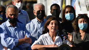 New York Governor Kathy Hochul (C) speaks, flanked by US Senator Chuck Schumer (L), New York Mayor Bill de Blasio (2nd L) and US President Joe Biden (3rd L), as the president tours a neighborhood affected by Hurricane Ida in Queens, New York on September 