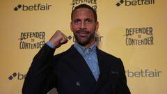 Rio Ferdinand poses after the press conference 