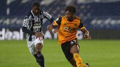 Soccer Football - Premier League - West Bromwich Albion v Wolverhampton Wanderers - The Hawthorns, West Bromwich, Britain - May 3, 2021 West Bromwich Albion&#039;s Ainsley Maitland-Niles in action with Wolverhampton Wanderers&#039; Adama Traore Pool via R