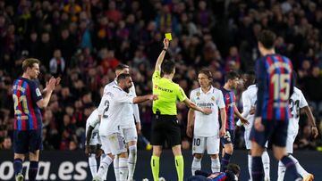 BARCELONA, SPAIN - MARCH 19: Luka Modric of Real Madrid is shown a yellow card by Referee De Burgos Bengoetxea during the LaLiga Santander match between FC Barcelona and Real Madrid CF at Spotify Camp Nou on March 19, 2023 in Barcelona, Spain. (Photo by Angel Martinez/Getty Images)
