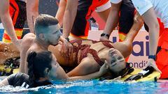 Artistic Swimming - FINA World Championships - Alfred Hajos Swimming Complex, Budapest, Hungary - June 22, 2022  Anita Alvarez of the U.S. receives medical attention during the women's solo free final REUTERS/Lisa Leutner