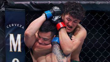 MIAMI, FLORIDA - APRIL 08: Raul Rosas Jr. (R) grapples with Christian Rodriguez in their bantamweight bout at Kaseya Center on April 08, 2023 in Miami, Florida.   Carmen Mandato/Getty Images/AFP (Photo by Carmen Mandato / GETTY IMAGES NORTH AMERICA / Getty Images via AFP)