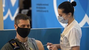 A member of the Armed Forces is being inoculated against the novel coronavirus COVID-19 with the AstraZeneca/Oxford vaccine obtained through the Covax scheme, at the CCK Cultural Centre in Buenos Aires on June 15, 2021. (Photo by Juan MABROMATA / AFP)