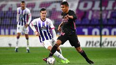 Casemiro of Real Madrid is challenged by Sergi Guardiola of Real Valladolid.