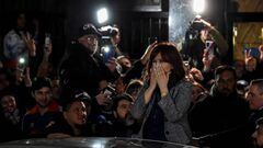 Argentina's Vice-President Cristina Fernandez (R) -- on trial for alleged corruption -- greets supporters demonstrating outside her residence in Buenos Aires, on August 29, 2022. - Fernandez de Kirchner, 69, is accused of fraudulently awarding public works contracts in her stronghold in Patagonia, and prosecutors have asked that she face 12 years in jail and a lifetime ban from politics. (Photo by Luis ROBAYO / AFP) (Photo by LUIS ROBAYO/AFP via Getty Images)