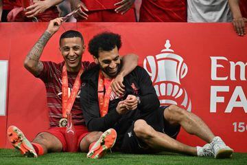 Thiago and Salah celebrate with their medals (Photo by Ben Stansall / AFP)