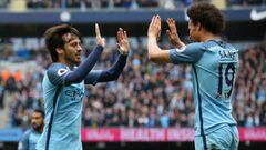 MANCHESTER, ENGLAND - MAY 13: David Silva of Manchester City celebrates scoring his sides first goal with Leroy Sane of Manchester City during the Premier League match between Manchester City and Leicester City at Etihad Stadium on May 13, 2017 in Manches