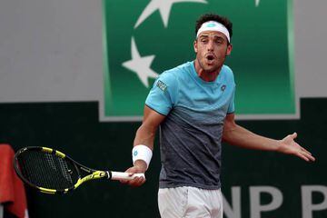 Marco Cecchinato of Italy reacts as he plays David Goffin of Belgium during their men's round of 16 match during the French Open.