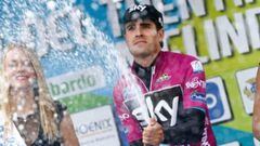 Mikel Landa popping the bubbly after his title win