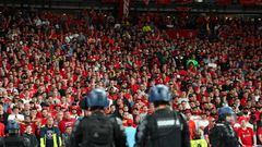 PARIS, FRANCE - MAY 28: Police and stwards watching Liverpool fans during the UEFA Champions League final match between Liverpool FC and Real Madrid at Stade de France on May 28, 2022 in Paris, France. (Photo by Robbie Jay Barratt - AMA/Getty Images)