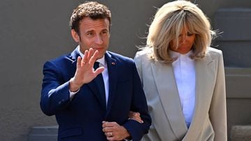 LE TOUQUET-PARIS-PLAGE, FRANCE - APRIL 24: Emmanuel Macron salutes voters as he leaves his house with Brigitte Macron to go vote on April 24, 2022 in Le Touquet-Paris-Plage, France. Emmanuel Macron and Marine Le Pen were both qualified on Sunday April 10th for France's 2022 presidential election second round to be held on April 24. This is the second consecutive time the two candidates face-off in the final round of elections. (Photo by Aurelien Meunier/Getty Images)