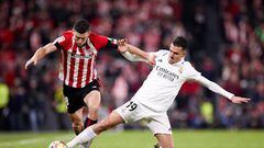 BILBAO, SPAIN - JANUARY 22: Oscar de Marcos of Athletic Club competes for the ball with Dani Ceballos of Real Madrid CF during the La Liga Santander match between Athletic Club and Real Madrid CF at San Mames  on January 22, 2023, in Bilbao, Spain. (Photo By Ricardo Larreina/Europa Press via Getty Images)