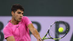 INDIAN WELLS, CALIFORNIA - MARCH 11: Carlos Alcaraz of Spain hits a backhand in his straight set win over Thanasi Kokkinakis of Australia during the BNP Parisbas Open at the Indian Wells Tennis Garden on March 11, 2023 in Indian Wells, California.   Harry How/Getty Images/AFP (Photo by Harry How / GETTY IMAGES NORTH AMERICA / Getty Images via AFP)