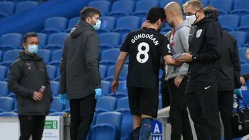 Manchester City&#039;s German midfielder Ilkay Gundogan leaves the pitch injured during the English Premier League football match between Brighton and Hove Albion and Manchester City at the American Express Community Stadium in Brighton, southern England 