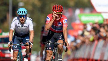 Team Quick Step's Belgian rider Remco Evenepoel (R) reacts at the end of the 20th stage of the 2022 La Vuelta cycling tour of Spain, a 181 km race from Moralzarzal to Puerto de Navacerrada, on September 10, 2022. (Photo by Oscar DEL POZO CANAS / AFP) (Photo by OSCAR DEL POZO CANAS/AFP via Getty Images)