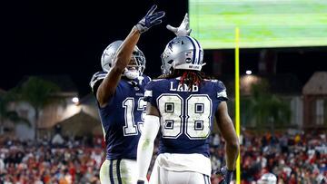 TAMPA, FLORIDA - JANUARY 16: CeeDee Lamb #88 of the Dallas Cowboys celebrates with Michael Gallup #13 after scoring a touchdown against the Tampa Bay Buccaneers during the fourth quarter in the NFC Wild Card playoff game at Raymond James Stadium on January 16, 2023 in Tampa, Florida.   Mike Ehrmann/Getty Images/AFP (Photo by Mike Ehrmann / GETTY IMAGES NORTH AMERICA / Getty Images via AFP)
