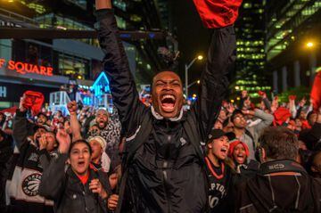 Toronto Raptors fans celebrate their win in the NBA championships in downtown Toronto