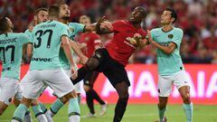 Manchester United&#039;s Paul Pogba (2nd R) is surrounded by Inter Milan players during the International Champions Cup football match between Manchester United and Inter Milan in Singapore on July 20, 2019. (Photo by Roslan RAHMAN / AFP)