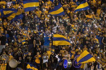 Tigres fans cheer for their team during the Mexican Apertura 2021 semi-final football match against Leon at Universitario Stadium in Monterrey, Mexico, on December 1, 2021. (Photo by Julio Cesar AGUILAR / AFP)