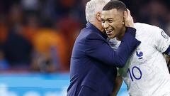 France's coach Didier Deschamps (L) and France's forward Kylian Mbapp� celebrate their team's victory after the Euro 2024 qualifying football match between the Netherlands and France at the Johan Cruijff ArenA in Amsterdam on October 13, 2023. (Photo by KENZO TRIBOUILLARD / AFP)
