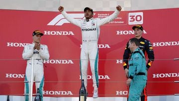 Formula One F1 - Japanese Grand Prix - Suzuka Circuit, Suzuka, Japan - October 7, 2018 Mercedes&#039; Lewis Hamilton celebrates winning the race on the podium REUTERS/Issei Kato