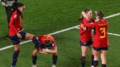 Spain's midfielder #06 Aitana Bonmati kisses the shoe of her teammate forward #18 Salma Paralluelo (L) after she scored her team's first goal during the Australia and New Zealand 2023 Women's World Cup semi-final football match between Spain and Sweden at Eden Park in Auckland on August 15, 2023. (Photo by Saeed KHAN / AFP).