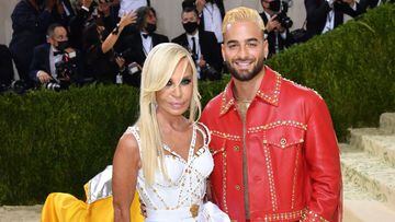 Italian fashion designer Donatella Versace (L) and Colombian singer Maluma arrive for the 2021 Met Gala at the Metropolitan Museum of Art on September 13, 2021 in New York. (Photo by Angela WEISS / AFP)