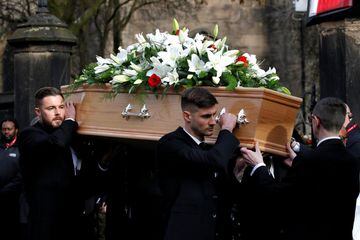 Stoke City's Jack Butland and Chesterfield's Joe Anyon carry the coffin of former England World Cup winning goalkeeper Gordon Banks