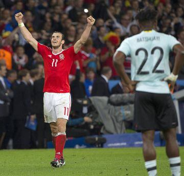 Bale (left) celebrates Wales' quarter-final win over Belgium.