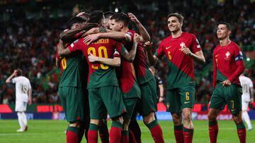 Portugal players celebrate their second goal scored by Portugal's forward Bernardo Silva during the UEFA Euro 2024 qualification match between Portugal and Liechtenstein at the Jose Alvalade stadium in Lisbon on March 23, 2023. (Photo by CARLOS COSTA / AFP) (Photo by CARLOS COSTA/AFP via Getty Images)