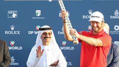 Jon Rahm of Spain celebrates after his victory at the end of the final round of the DP World Tour Golf Championship at Jumeirah Golf Estates on November 19, 2017, in Dubai. Tommy Fleetwood won the European Tour Order of Merit after a tense battle with Justin Rose that was decided only on the 72nd green of the DP World Tour Championship, the final event of the season. Spain&#039;s Jon Rahm won the $8 million (6.8 million euros) tournament, firing a five-under par 67 that gave him a one-shot advantage at 19-under par 269 over Ireland&#039;s Shane Lowry (63) and Thailand&#039;s Kiradech Aphibarnrat (67).  / AFP PHOTO / KARIM SAHIB