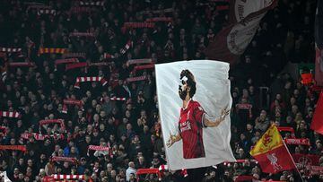 Liverpool fans wave a large flag of Liverpool&#039;s Egyptian midfielder Mohamed Salah ahead of the UEFA Champions League round of 16 second leg football match between Liverpool and Inter Milan at Anfield in Liverpool, north west England on March 8, 2022.