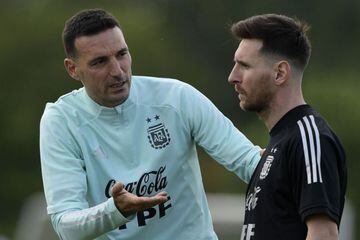 Argentina's coach Lionel Scaloni (L) gives instructions to forward Lionel Messi during a training session in Ezeiza, Buenos Aires, on November 9, 2021, ahead of FIFA World Cup Qatar 2022 qualifier matches against Uruguay on November 12 and against Brazil 