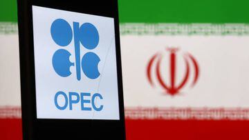 OPEC logo displayed on a phone screen and Iranian flag displayed on a screen in the background are seen in this illustration photo taken in Poland on October 6, 2022. (Photo by Jakub Porzycki/NurPhoto via Getty Images)