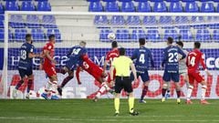 HUESCA, SPAIN - FEBRUARY 21: Jorge Pulido of SD Huesca scores his team's second goal during the La Liga Santander match between SD Huesca and Granada CF at Estadio El Alcoraz on February 21, 2021 in Huesca, Spain. Sporting stadiums around Spain remain und