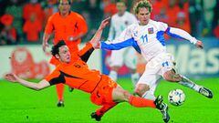 Dutch soccer player Mark van Bommel, left and Pavel Nedved of Czech Republic battle for the ball during the Euro 2004 qualifying group 3 soccer match between The Netherlands and Czech Republic, at De Kuip stadium in Rotterdam, The Netherlands, Saturday, M