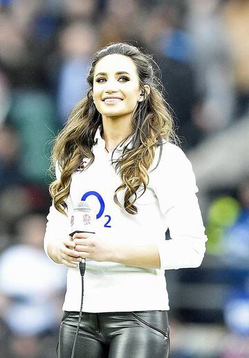 English soprano Laura Wright sings the National Anthem before the match.