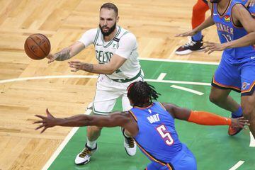 BOSTON, MA - APRIL 27: Evan Fournier #94 of the Boston Celtics passes the ball while under pressure in the arc during a game against the Oklahoma City Thunder at TD Garden on April 27,