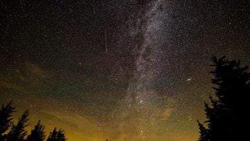 This NASA handout photo released on August 11, 2021, shows a 30 second exposure,as a meteor streaks across the sky during the annual Perseid meteor shower on August 10, 2021, in Spruce Knob, West Virginia. (Photo by Bill INGALLS / NASA / AFP) / RESTRICTED