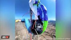 In a viral video, professional paraglider Kevin Philipp’s parachute got tangled and he nearly fell to his death, saving himself with one second to spare.