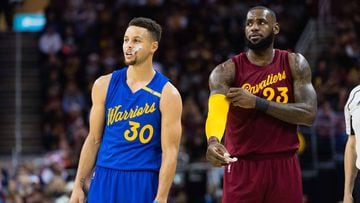 CLEVELAND, OH - DECEMBER 25: Stephen Curry #30 of the Golden State Warriors and LeBron James #23 of the Cleveland Cavaliers pause on the court during the first half at Quicken Loans Arena on December 25, 2016 in Cleveland, Ohio. NOTE TO USER: User express