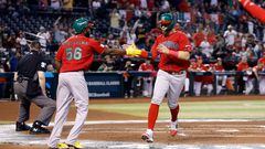 PHOENIX, ARIZONA - MARCH 15: Joey Meneses #32 high fives Randy Arozarena #56 of Team Mexico after scoring against Team Canada during the first inning of the World Baseball Classic Pool C game at Chase Field on March 15, 2023 in Phoenix, Arizona.   Chris Coduto/Getty Images/AFP (Photo by Chris Coduto / GETTY IMAGES NORTH AMERICA / Getty Images via AFP)