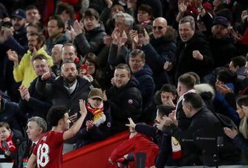 Liverpool's Curtis Jones waves to fans after the match