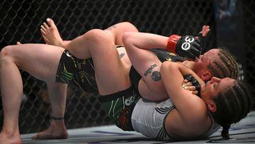 Mexico's mixed martial arts fighter Alexa Grasso (bottom) fights Kyrgyzstan's mixed martial arts fighter Valentina Shevchenko during their UFC 285 women's flyweight title bout at T-Mobile Arena, in Las Vegas, Nevada, on March 4, 2023. (Photo by Patrick T. Fallon / AFP)